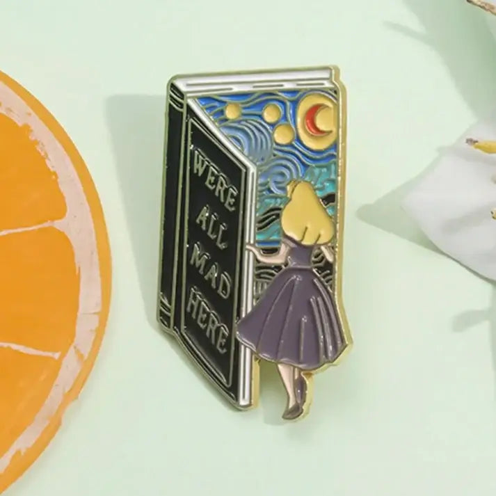 Whimsical Alice-Inspired “We’re All Mad Here” Book Pin